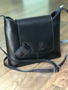 A beautiful unique design for dress or casual. This structured leather purse made in Italy is classy, roomy and secure with magnetic flap closure. The wide bottom creates a roomy bag that easily accommodates wallet, sunglasses, cell phones and other essentials. #italianleatherhandbags #italianleatherbag #leatherhandbags #crossbodypurses #shoulderbags #giftideas #giftforher #giftsforfriends #blackbag #pursesandbags