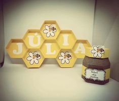 some honeycombs with bees on them sitting next to a jar