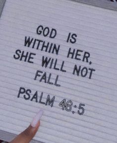 someone holding up a sign that says god is within her, she will not fall