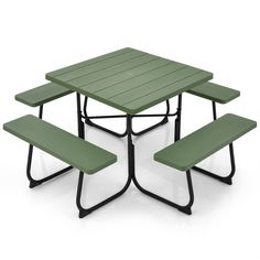 a green picnic table with two benches underneath it