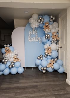 balloons and teddy bears are arranged in the shape of an arch for a baby shower