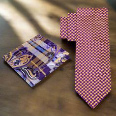 This luxurious silk necktie features a distinctive houndstooth pattern in bold shades of gold and purple. The classic houndstooth design is given a modern twist with the vibrant color combination, creating a striking and sophisticated accessory. The high-quality silk fabric enhances the tie’s rich texture and visual appeal, making it a perfect choice for both formal and semi-formal occasions. Dress Shirts White Dress Shirt: A crisp white dress shirt provides a neutral backdrop that allows the go Luxury Multicolor Ties For Business, Luxury Semi-formal Neckwear With Ties, Luxury Patterned Ties For Business, Luxury Multicolor Classic Ties, Patterned Luxury Ties For Semi-formal Occasions, Brown Bow Tie, Grey Bow Tie, Neutral Backdrop, Kids Ties