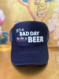 Don't let a bad day keep you down, wear the Its a bad day to be a Beer Trucker Hat instead! This quirky and playful trucker hat is perfect for any beer lover who doesn't take themselves too seriously. With a unique design and comfortable fit, you'll be sure to turn heads and spread some cheer.