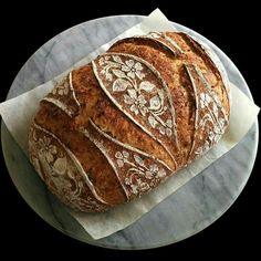 a loaf of bread sitting on top of a white plate