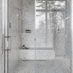 a walk in shower sitting next to a window