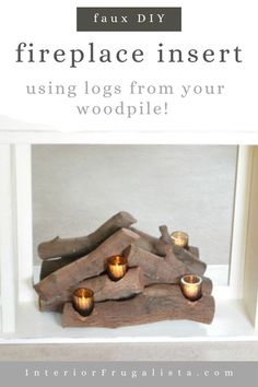 a fireplace insert with candles in it and text overlay that reads, faux diy fireplace insert using logs from your woodpile