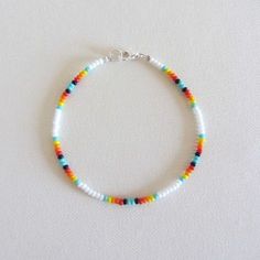 a bracelet with multicolored beads on it