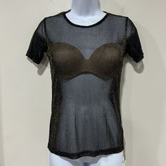 New With Tags Still Attached Is This Sexy Tee Shirt From Mangopop In Excellent Condition. Sheer Black With A Sparkling Gold Touch. Short Sleeve. Measures Approximately 22” Long And 15 1/2” Armpit To Armpit. Tag States Size Xl But It Is Not True To Size So I Am Listing It As A Small. Please See Measurements I Have Listed To Ensure Fit. Smoke Free Home. Fast Shipping. Y2k Tops With Built-in Bra For Night Out, Y2k Top With Built-in Bra For Night Out, Y2k Black Top With Built-in Bra, Black Tops With Built-in Bra For Club, Casual Party Tops With Built-in Bra, Black Stretch T-shirt For Club, Stretch Black T-shirt For Club, Y2k Short Sleeve Club T-shirt, Black Y2k Top For Club