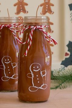 two glass jars with gingerbreads drawn on them