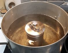 a large metal pot sitting on top of a stove