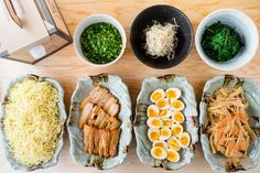 an assortment of food items displayed in bowls on a table