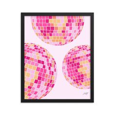 three pink and yellow squares on a white background in a black framed art print frame