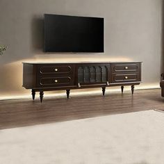 a living room scene with focus on the entertainment center and large screen tv mounted to the wall