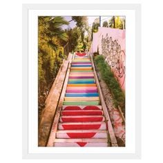 colorful stairs with hearts painted on them in front of graffiti covered walls and trees, framed in black wood frame