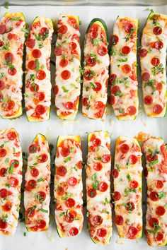 several different types of food are laid out on trays and ready to be cooked