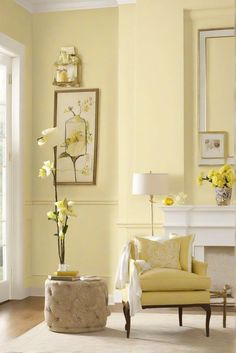 a living room with yellow walls and furniture