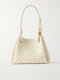 Bottega Veneta's 'Parachute' shoulder bag is intrecciato woven from leather - a symbol of the label's artistry, and which feels beautifully soft and pliable. In a 'small' size that expands slightly by virtue of the side folds, it'll fit your phone, cardholder and AirPods. Bottega Bag, Knotted Top, Sacs Design, Dream Bags, Flat Dress Shoes, Bottega Veneta Intrecciato, Raffia Bag, Air Pods, Cute Bags