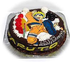 a birthday cake decorated with an image of a wrestler and gummy bears on it