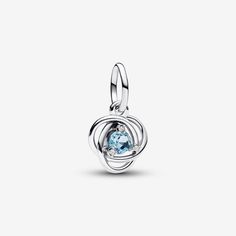 This intricate Sea Aqua Blue Eternity Circle Dangle Charm is a must-have infinity charm for your Pandora Moments collection. Crafted in lustrous sterling silver, it features an openwork infinity braid decorated with a central sea aqua blue man-made crystal, elegantly surrounded by three clear cubic zirconia. The intricate design symbolizes eternity and adds an additional layer of meaning to the piece. Elevate your bracelet with this timeless piece or gift it as a representation of an everlasting Infinity Braid, March Birthday Gifts, Infinity Charm, Dangle Necklaces, Dangle Charms, March Birth Stone, Lab Created Diamonds, Pandora Charms, Aqua Blue