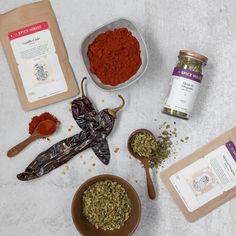 various spices and seasonings laid out on a table