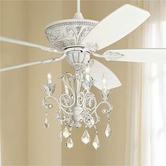 a white ceiling fan with crystal chandelier hanging from it's center blade