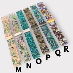 several different colored watch bands with the words mono on them