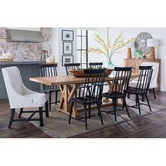 a dining room table with six chairs around it