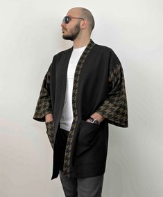 "Cotton linen is the material used for this loose-style Japanese kimono cardigan. t is designed by adding two types of fabric, black, and houndstooth, by patchwork method. The sleeves are wide and fall below the elbow, and there are two large pockets on the front. It is recommended that you choose the size you usually wear for the men's haori jacket since it fits loosely. Fabrics made of this material are one of the more popular choices because they are naturally breathable and cool to wear. - C Casual Patchwork Kimono For Fall, Black Oversized Cotton Kimono, Fall Patchwork Kimono With Kimono Sleeves, Fall Patchwork Kimono, Black Cotton Outerwear With Kimono-style Sleeves, Black Cotton Outerwear With Kimono Sleeves, Black Kimono Sleeve Outerwear For Work, Black Outerwear With Kimono Sleeves For Work, Winter Black Cotton Kimono