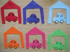 paper houses and cars made to look like they are in different colors