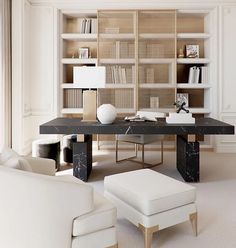 a living room filled with furniture and bookshelves