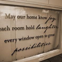 a sign that is on the side of a building saying, may our home know how each room hold laughter, every window open to great possibilities