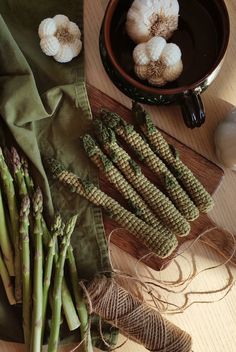 asparagus and garlic on a wooden table