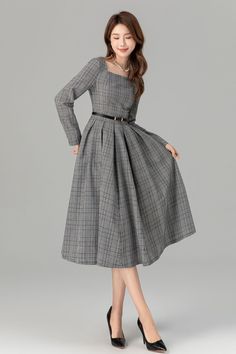 "The flared silhouette adds a feminine touch, making it suitable for various occasions. The wearer pairs it with a chic black handbag, completing the ensemble. Overall, this dress exudes understated elegance and style.  Details * 15% linen , 45% cotton , 40% polyester * Classic and beautiful plaid  * Fitted waist to show off your curves * Square neckline * Long sleeves  * Side zipper in the right side * Pleated on the waist * Midi dress * Wash by hand or machine with cold water MODEL SIZE Bust 8 Square Dress Outfit, Gray A-line Winter Dresses, Winter A-line Pleated Maxi Dress, Retro Dress Outfits 90s, Winter A-line Midi Dress For Office, A-line Fit And Flare Midi Dress For Work, Spring Gray A-line Maxi Dress, Elegant Tea Length Fall Dress, Elegant Tea-length Fall Dress