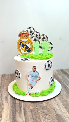 a birthday cake with a soccer player on it