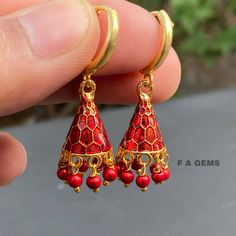 ● Item Detail :- Gorgeous Indian style minakari enamaled Jhumka earrings ,hoops earrings,Cone shape mini jumki  :- Super light weight :- 1.5 inches long  :- Colour : Red  :- Gold plated :- Hoops Earrings  ( You can change the hook without any worry. We have three types of hooks,Leverbacks hook/Hoops/french hook , You can inform me about this by messaging me while placing the order. ) **important Notice** ~* After the order, give your full address, Pin code/zip code, Full name, Contact namber/ema Meenakari Earrings For Puja, Round Shape, Meenakari Round Earrings For Puja, Meenakari Earrings For Puja, Round Meenakari Earrings For Puja, Meenakari Earrings As Gift, Meenakari Earrings For Gift, Meenakari Hoop Earrings For Celebrations In Temple Jewelry Style, Meenakari Hoop Earrings For Celebration, Meenakari Temple Jewelry Hoop Earrings For Celebration