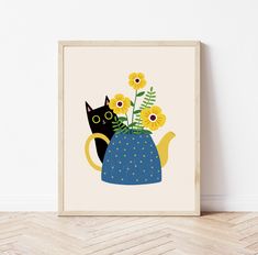 a black cat sitting in a blue teapot with yellow flowers