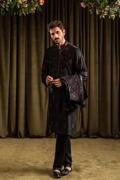 A black cotton silk kurta and pajama set with floral patterns merged with an inner border details, further accentuated with all over sequin details. 

Color: Black
Fabric: Cotton Silk Omar Farooq, Waistcoat Designs, Mens Photoshoot, Men Waistcoat, Prince Coat, Wahaj Ali, Mens Waistcoat, Mens Photoshoot Poses, Silk Kurta