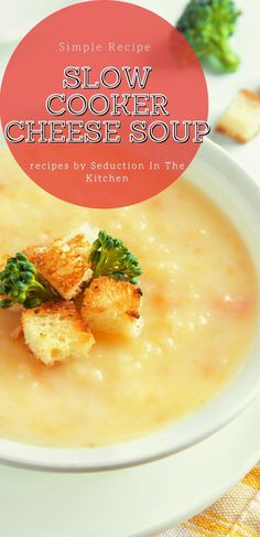 a white plate topped with soup and croutons