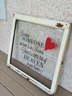 an old window frame with a red heart on it