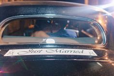 an old black car with the word first married written on it