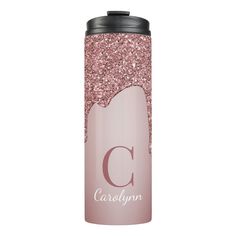 a pink glitter water bottle with the letter c on it