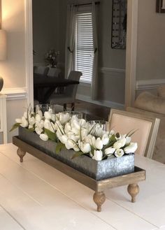 a tray with flowers sitting on top of a table