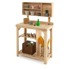 a wooden table with shelves and baskets on it