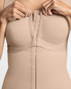 Get everything in one piece! This body shaper features an inner layer of our signature PowerSlim® to sculpt your entire torso, as well as an outer layer of microfiber for a soft feel. The built-in back support bra has a front hook-and-eye closure and a supportive elasticated underbust band for incredible support. The cups are made of light fabric that is soft to the touch, and they don’t have any padding for a completely natural look. The padded straps are adjustable through a practical system o Support Bra, Leg Bands, Legging Sport, Back Support, Body Shaper, Support Bras, Body Shapers, Natural Look, Plastic Surgery