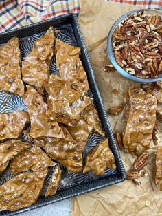 there are many pieces of pecans on the table next to some other food items