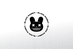 a black rabbit logo with teeth and fangs