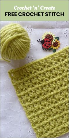 a crochet hat with a button on it and a ball of yarn next to it