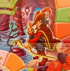 the box is full of candy and candies, including an image of a man with a hat