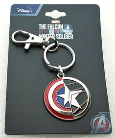 a captain america keychain with the falcon symbol on it's back side