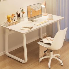 a white desk with a computer on it and a chair in front of the desk